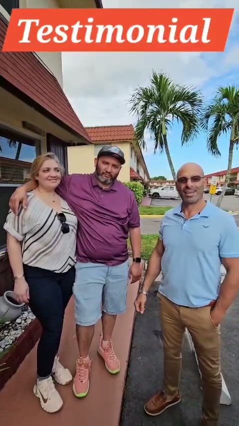 Shalom Dgani with happy clients after a successful South Florida real estate closing