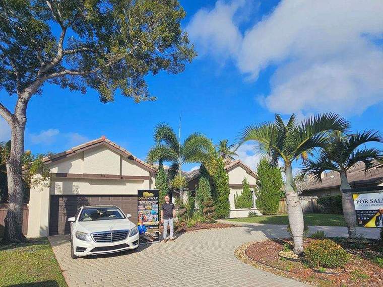 Mediterranean-style home with a Dgani Group For Sale sign, South Florida