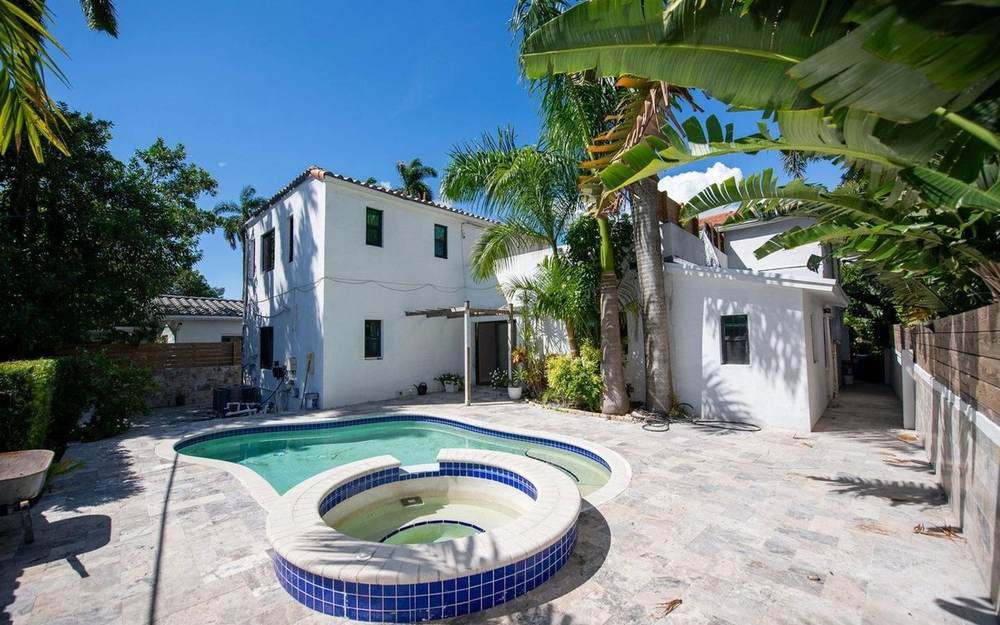 Mediterranean-style home with a pool and spa, represented by Dgani Group in South Florida