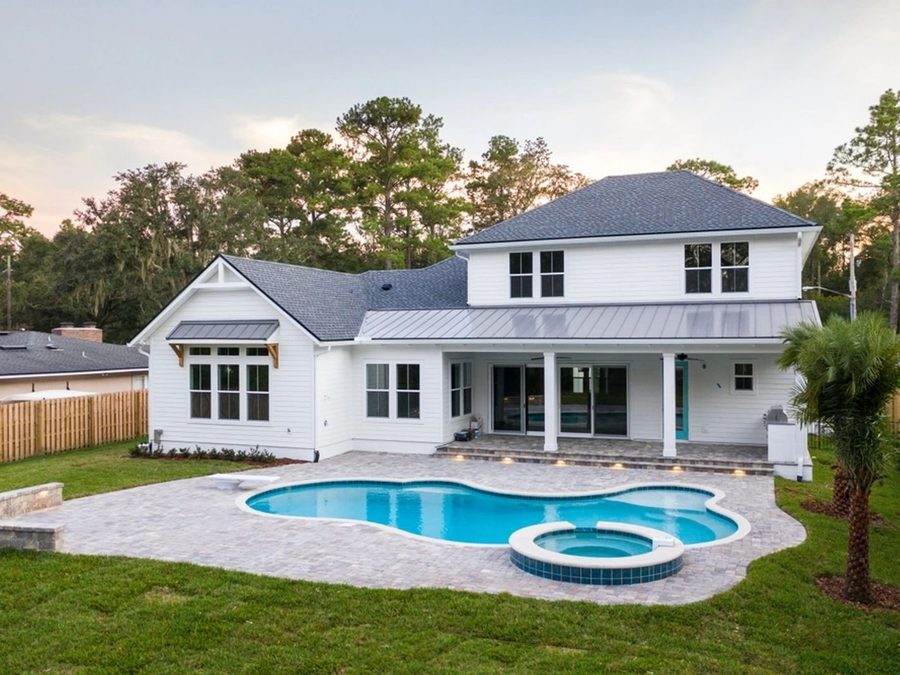 Two-story home with a pool and spa represented by Dgani Group in South Florida